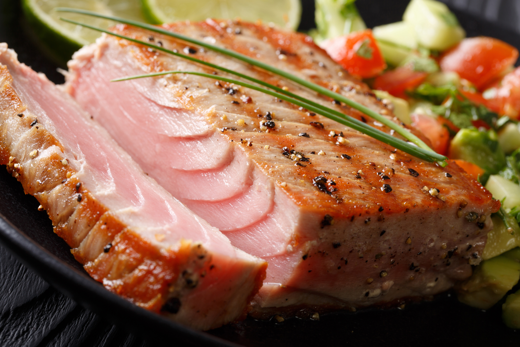 Delicious grilled steak steak in a lime marinade macro on a plate.