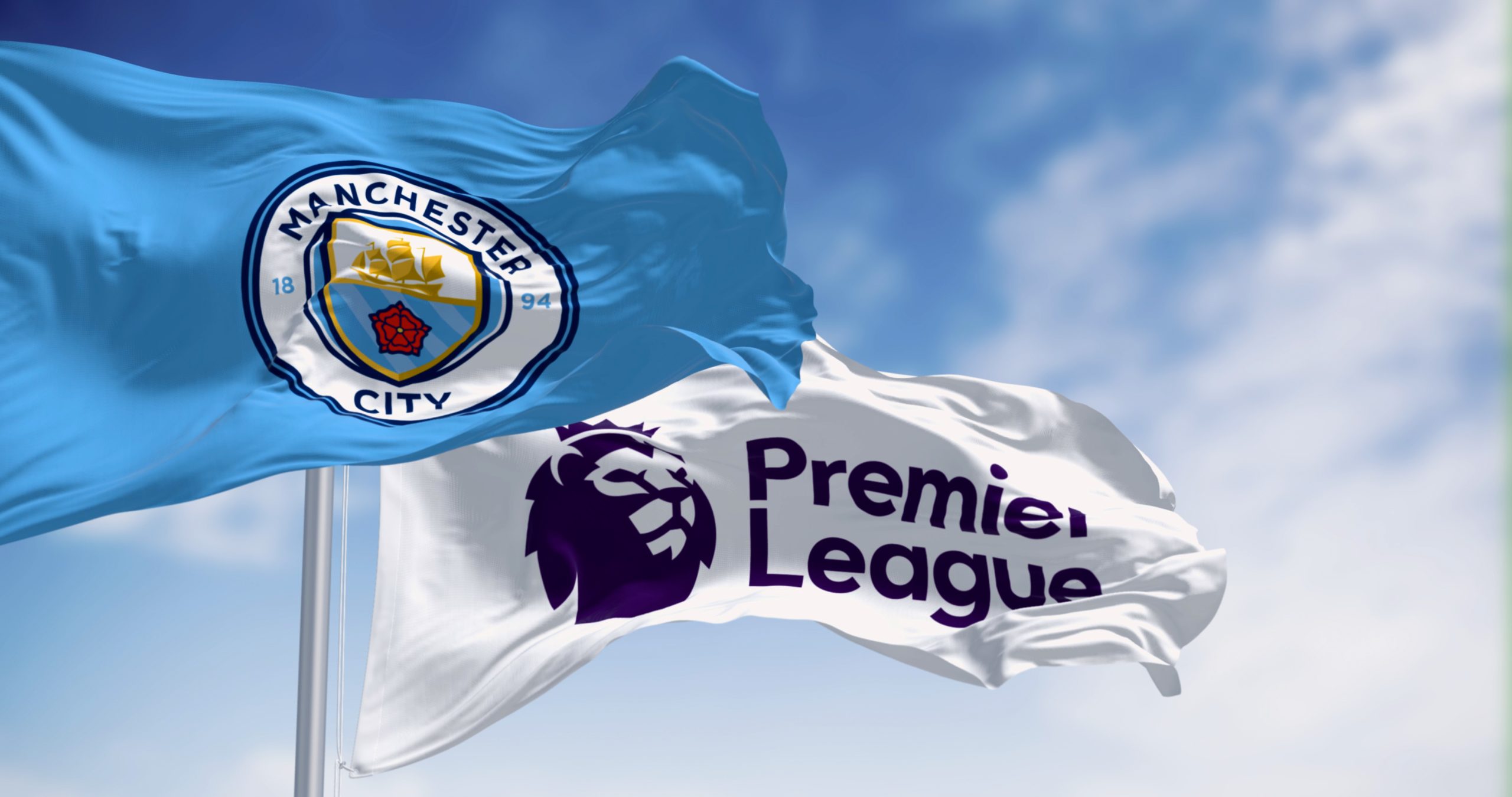 Manchester, UK, sept 10 2023: Flags of Manchester City and Premier League waving together on a clear day. Illustrative editorial 3d illustration render. Rippled fabric. Waving flag