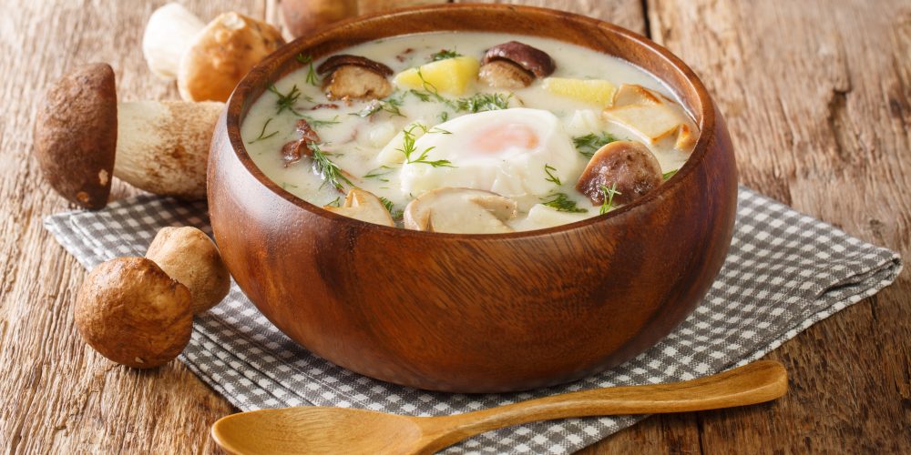 Southern Bohemian Potato Mushroom Soup Kulajda close-up in a bowl on the table.