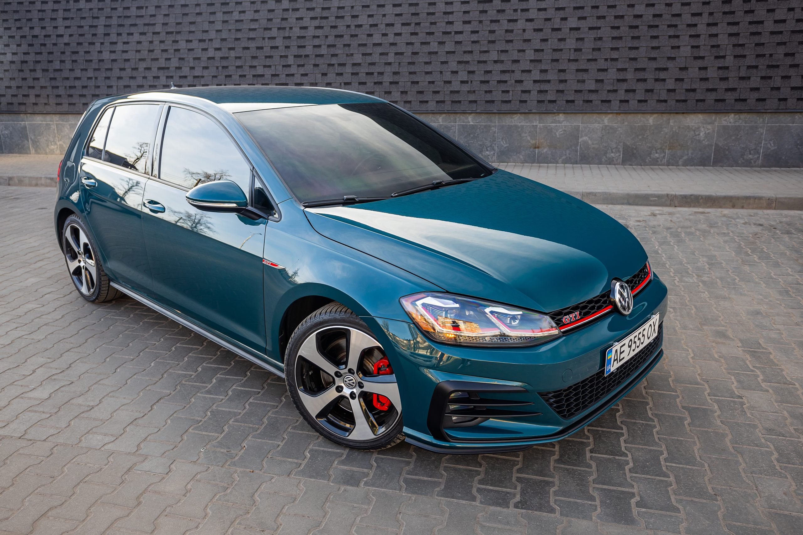 Krivoy Rog, Ukraine  March 24, 2024: Photo of green car Volkswagen Golf GTI on the street.