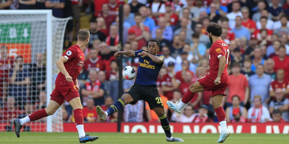 23rd August 2019 , Anfield, Liverpool, England; Premier League Football, Liverpool vs Arsenal ; Mohamed Salah (11) of Liverpool has a shot on goal blocked by the hand of Joe Willcock (28) of Arsenal Credit: Conor Molloy/News Images Premier League/EFL Football images are subject to DataCo Licence