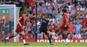 23rd August 2019 , Anfield, Liverpool, England; Premier League Football, Liverpool vs Arsenal ; Mohamed Salah (11) of Liverpool has a shot on goal blocked by the hand of Joe Willcock (28) of Arsenal Credit: Conor Molloy/News Images Premier League/EFL Football images are subject to DataCo Licence