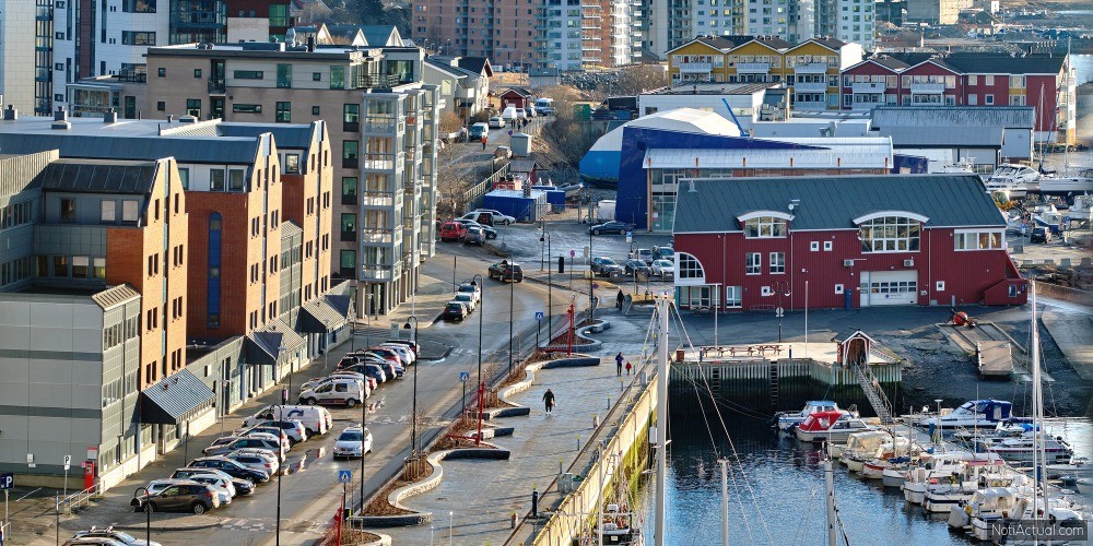 The busy city of Bodo and its surroundings by the harbor and seaside. Landscape view of a dockyard during the day in summer. Small fishing town for tourists and recreational activities for a holiday.