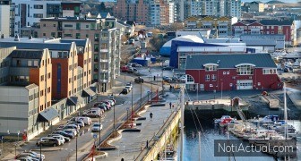 The busy city of Bodo and its surroundings by the harbor and seaside. Landscape view of a dockyard during the day in summer. Small fishing town for tourists and recreational activities for a holiday.