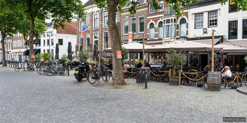 Zaltbommel, Gelderland, The Netherlands - People sitting on sunn