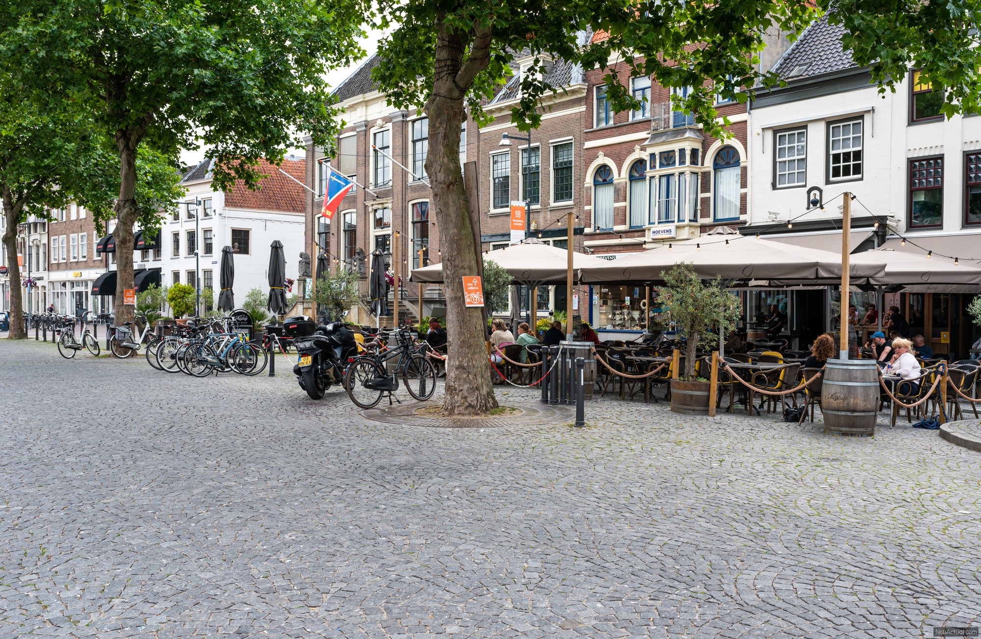 Zaltbommel, Gelderland, The Netherlands - People sitting on sunn