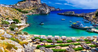 Lindos city on Rhodes island, Greece. St Paul's Bay Beach and the Acropolis, on Rhodos Island, Greece at Aegean Sea, Europe
